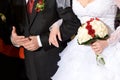 Red and white roses in the bouquet of the bride