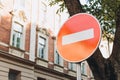 Red and white round stop sign on the street in the city street, summer time Royalty Free Stock Photo