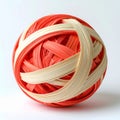 Red and White Rubber Band Ball with Textured Surface on a Plain Background Royalty Free Stock Photo