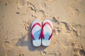 Red and white sandal on the beach Royalty Free Stock Photo
