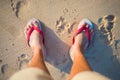 Red and white sandal on the beach Royalty Free Stock Photo