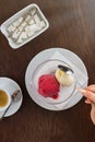 Red and white scoop of ice cream. Espresso coffee cup and sugar bowl with sugar Royalty Free Stock Photo