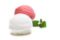 A red and a white scoop of ice cream with mint leaves Royalty Free Stock Photo