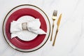 Red and white serving plate with golden tableware Royalty Free Stock Photo