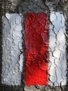 Red and white sign painted on rock marking hiking trail or the Swiss mountain trail marking Royalty Free Stock Photo