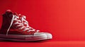 Red and White Sneakers on Red Background