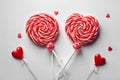 Red and white spiral lollypops with two red lollipops in the shape of a heart. Royalty Free Stock Photo