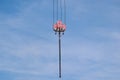 red and white steel tower crane hoist closeup. building construction industry. lifting and hoisting device Royalty Free Stock Photo