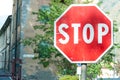 Red and white stop road sign in a street