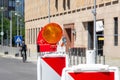 Red and white street barriers with flashlight to secure a construction site, roadworks, road under construction. Temporary fencing Royalty Free Stock Photo