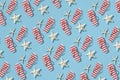 Red and white striped beach slippers and white starfishes on a light blue background Royalty Free Stock Photo