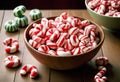 Red and White Striped Candies on Wooden Surface Royalty Free Stock Photo