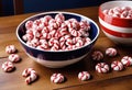 Red and White Striped Candies on Wooden Surface Royalty Free Stock Photo