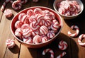 Red and White Striped Candies on Wooden Surface Royalty Free Stock Photo