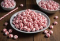 Red and White Striped Candies on Wooden Surface Royalty Free Stock Photo