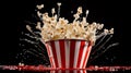 Red and white striped popcorn bucket against a dark moody background.