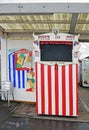 A red and white Punch and Judy Stand