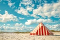 A red and white striped tent on a sandy beach under a blue sky. Generative AI Royalty Free Stock Photo