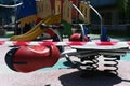 A red-white stripes barricade tape blocked off a children playground. Royalty Free Stock Photo