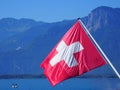 Red and white Swiss national flag at Lake Geneva in Switzerland Royalty Free Stock Photo