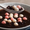 Red and white tangyuan with red bean soup