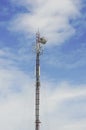 Red and White Telecommunication tower with blue sky and cloud