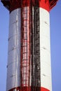 Red and white tube boiler with cables of telecommunications equipment, primarily for cellular transmission