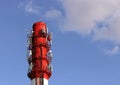 Red and white tube boiler with cables of telecommunications equipment, primarily for cellular transmission