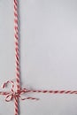 Red white twine tied in bow,christmas, valentines day  wrap decoration , package rope on white background Royalty Free Stock Photo