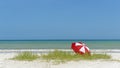 Red and white umbrella on beach Royalty Free Stock Photo