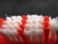 red and white used toothbrush