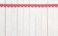 Red and White Valentines Day Hearts in a Row at the top of White Boards Background with copy space below. It`s a wide horizontal