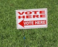 Red and White Vote Here Sign Royalty Free Stock Photo