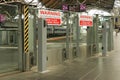 Red and white warning, sliding gates open without notice signs at Southern Cross Station, Melbourne Royalty Free Stock Photo