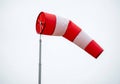 Red and white wind sock in sky Royalty Free Stock Photo
