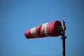 Red white windbag in the harbor of IJmuiden in the Nehterlands Royalty Free Stock Photo