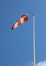 red and white windsock to indicate the direction of the air flow