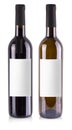 The red and white wine bottles with label isolated over white background Royalty Free Stock Photo
