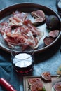 Red and white wine and bruschetta with bacon on a dinner table Royalty Free Stock Photo