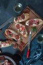 Red and white wine and bruschetta with bacon on a dinner table Royalty Free Stock Photo