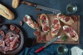 Red and white wine and bruschetta with bacon on a dinner table Royalty Free Stock Photo