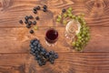 Red and white wine glasses and grape on wooden table Royalty Free Stock Photo