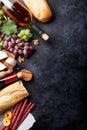 Red and white wine, grape, cheese and sausages Royalty Free Stock Photo