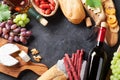 Red and white wine, grape, cheese and sausages Royalty Free Stock Photo