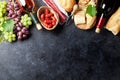 Red and white wine, grape, cheese and sausages Royalty Free Stock Photo