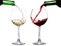 Red and white wine poring in two glasses Royalty Free Stock Photo