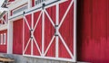 Red and white wood buildings and big gates