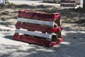 Red and white wooden barrage on the city sidewalk Royalty Free Stock Photo