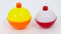 Red and white and yellow, orange day-glo fishing bobbers Royalty Free Stock Photo