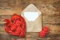 Red wicker heart, envelope with blank note Royalty Free Stock Photo